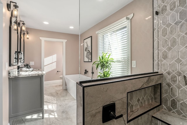 bathroom with vanity and separate shower and tub