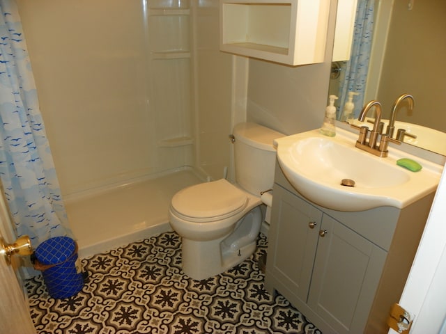 bathroom with toilet, tile patterned flooring, vanity, and a shower with shower curtain