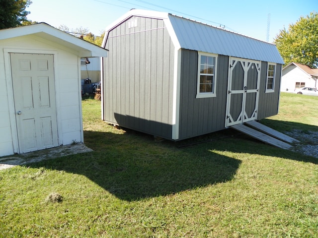 view of outbuilding with a lawn