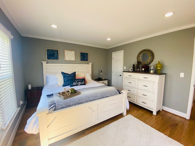 bedroom featuring dark hardwood / wood-style flooring and crown molding