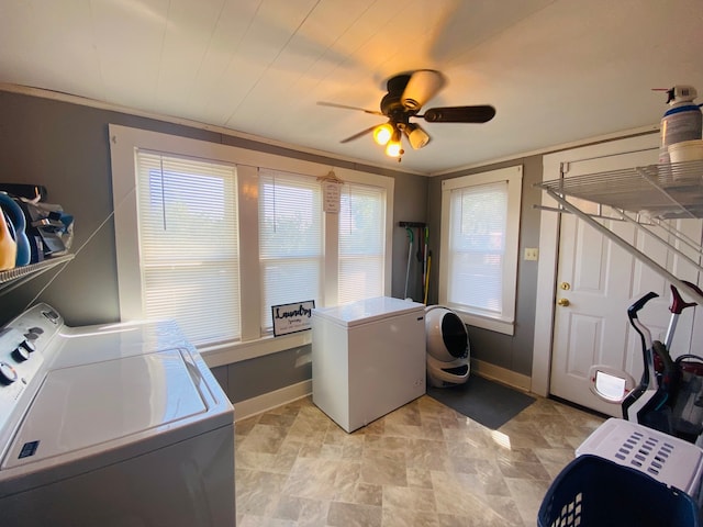 washroom featuring ornamental molding, independent washer and dryer, and ceiling fan