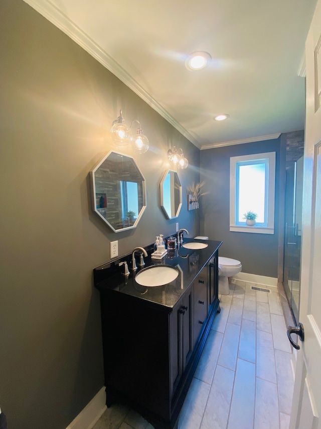 bathroom featuring vanity, crown molding, a shower, tile patterned floors, and toilet