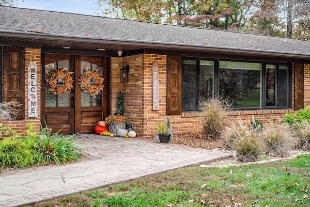 view of exterior entry featuring french doors