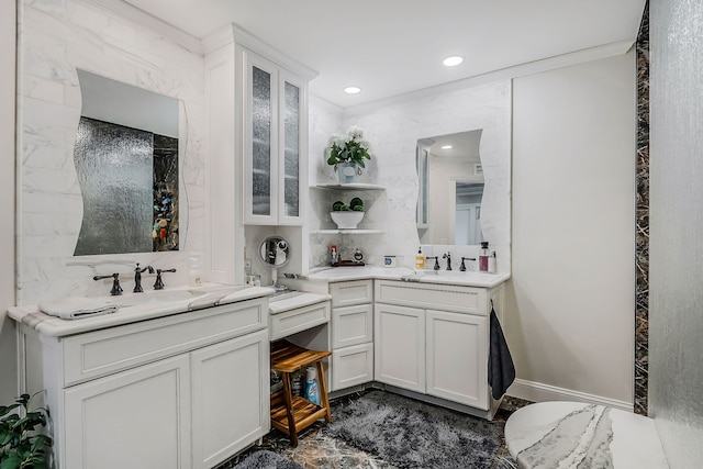 bathroom with vanity and ornamental molding