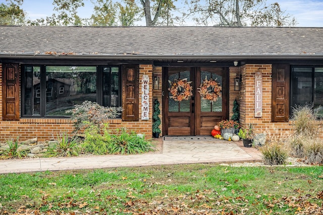view of exterior entry featuring a porch
