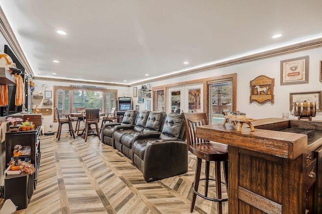 living room with light parquet flooring and crown molding