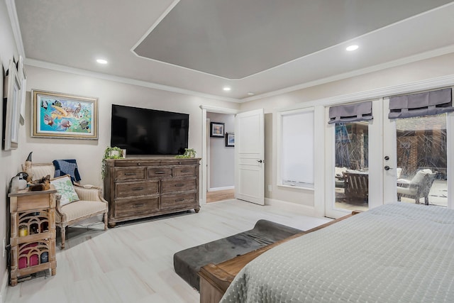 bedroom featuring access to exterior, light wood-type flooring, crown molding, and french doors