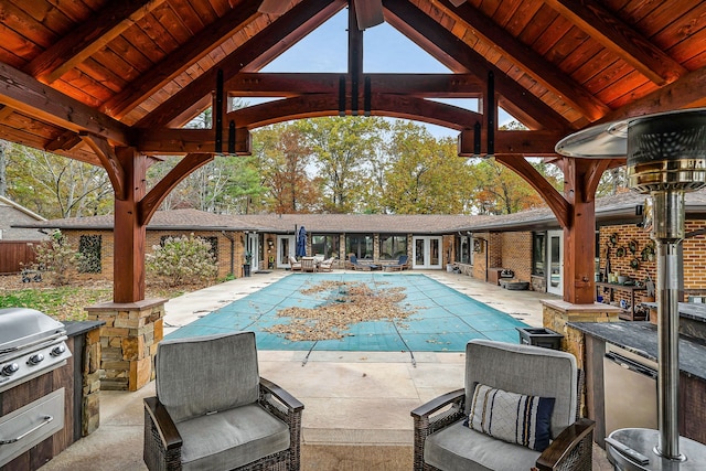 view of swimming pool with area for grilling, a patio, and a gazebo