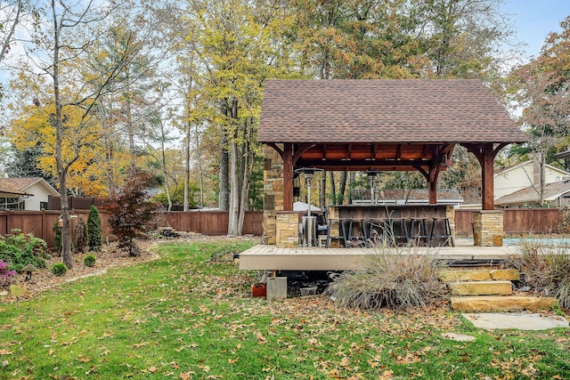 view of yard with exterior bar and a gazebo