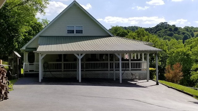 exterior space with a carport