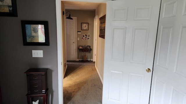 hallway with carpet flooring