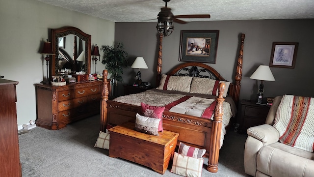 bedroom featuring light carpet, a textured ceiling, and ceiling fan