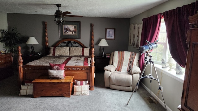 carpeted bedroom with a textured ceiling and ceiling fan