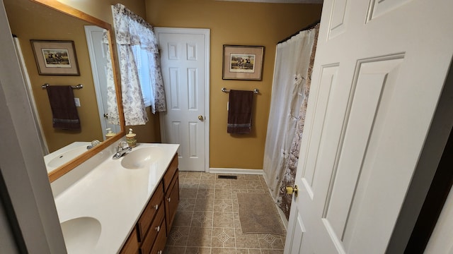 bathroom with vanity and tile patterned floors