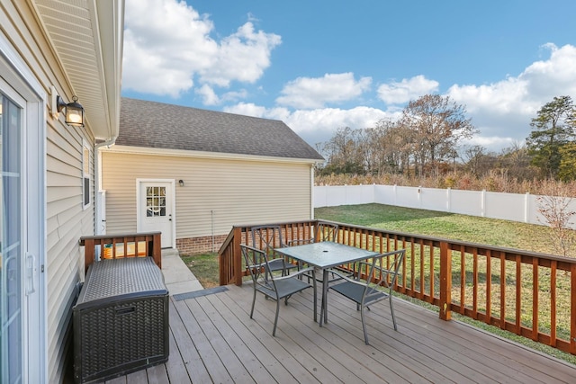 wooden deck with a yard