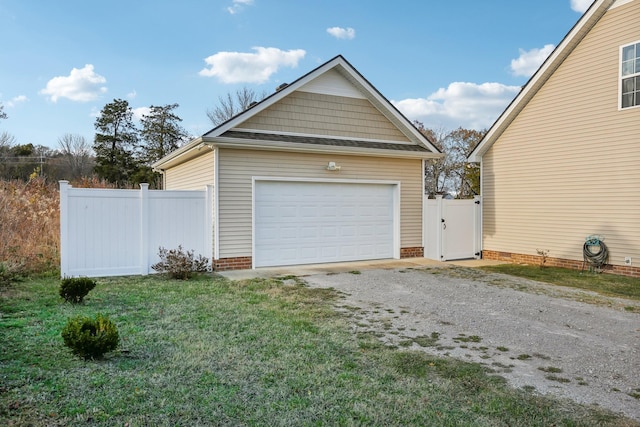 garage featuring a lawn