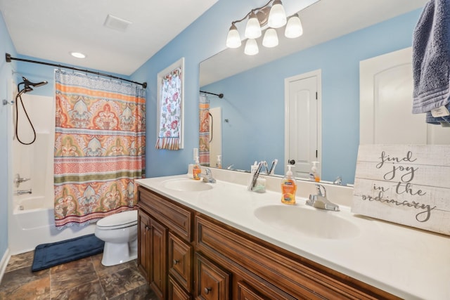 full bathroom featuring shower / bath combination with curtain, vanity, and toilet