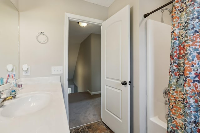 bathroom with shower / bathtub combination with curtain and vanity