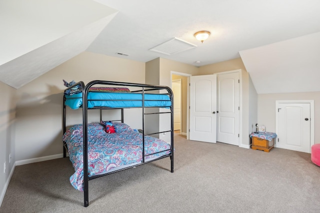 bedroom with carpet and lofted ceiling