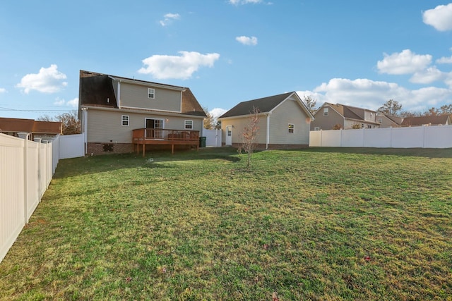 view of yard with a wooden deck