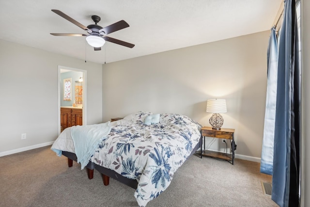 bedroom featuring connected bathroom, ceiling fan, and carpet