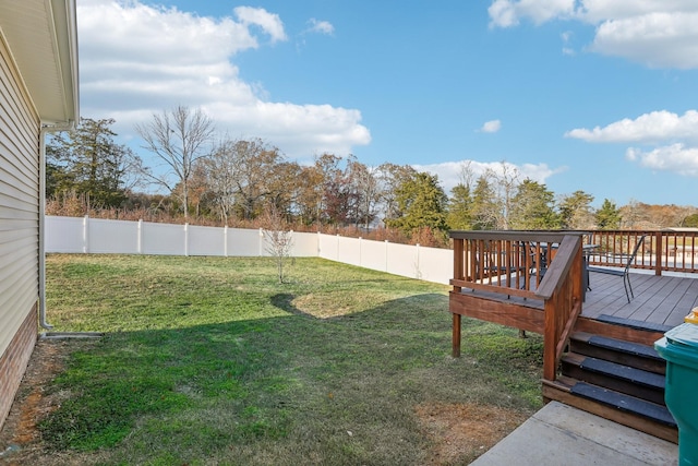 view of yard featuring a wooden deck