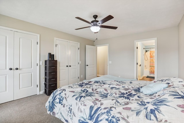 bedroom featuring ceiling fan, light carpet, connected bathroom, and multiple closets