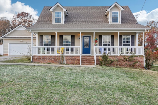 cape cod home featuring a porch, a garage, and a front lawn