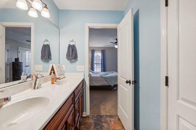 bathroom featuring ceiling fan and vanity