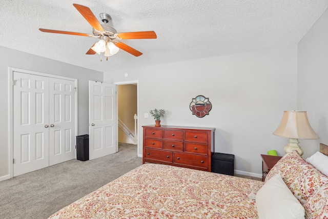 bedroom with light carpet, a textured ceiling, a closet, and ceiling fan