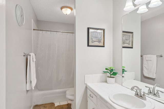 full bathroom featuring a textured ceiling, tile patterned floors, vanity, toilet, and shower / bath combo with shower curtain