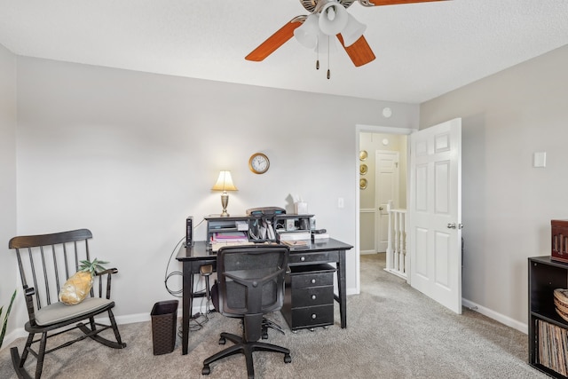 office featuring carpet floors and ceiling fan