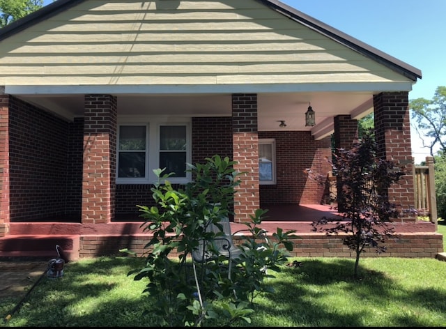 back of house with a yard