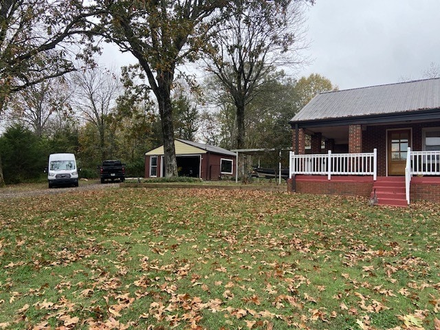 view of yard with covered porch