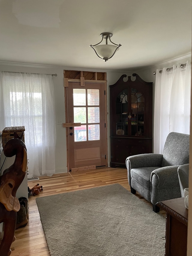 sitting room with light hardwood / wood-style flooring