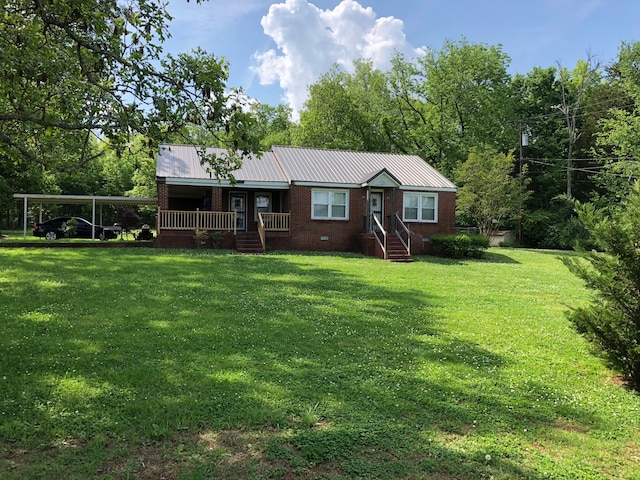 view of front of home featuring a carport and a front lawn