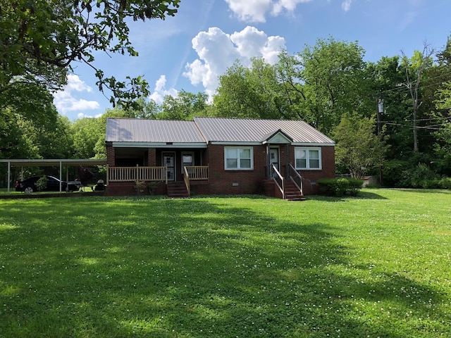 view of front of property featuring a carport and a front lawn