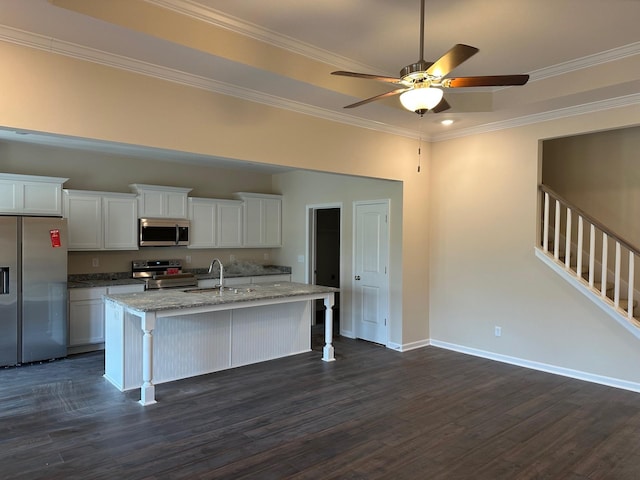 9025 Ada Way, Fairview, TN 37062 - kitchen with stainless steel appliances, dark wood-style floors, an island with sink, a kitchen bar, and crown molding