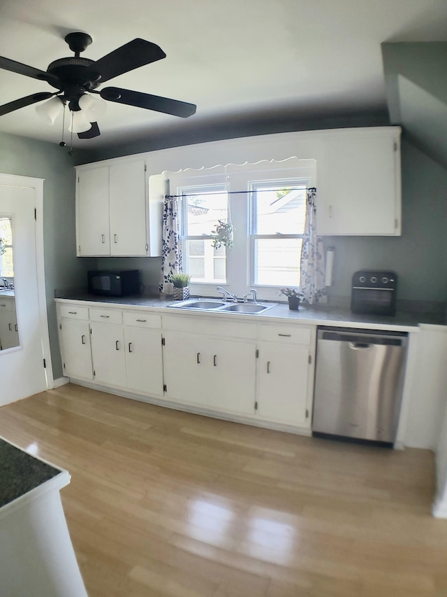 kitchen featuring dishwasher, sink, ceiling fan, white cabinetry, and light wood-type flooring