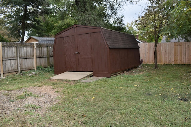 view of outbuilding featuring a yard