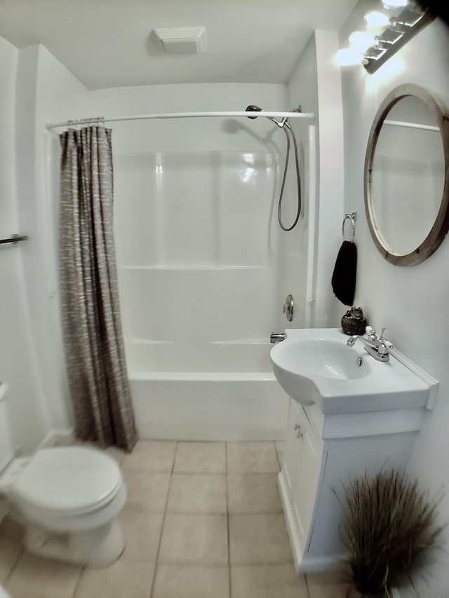 full bathroom featuring tile patterned flooring, vanity, toilet, and shower / bathtub combination with curtain