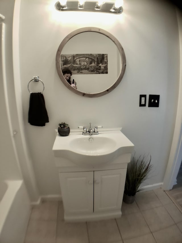 bathroom with tile patterned flooring and vanity