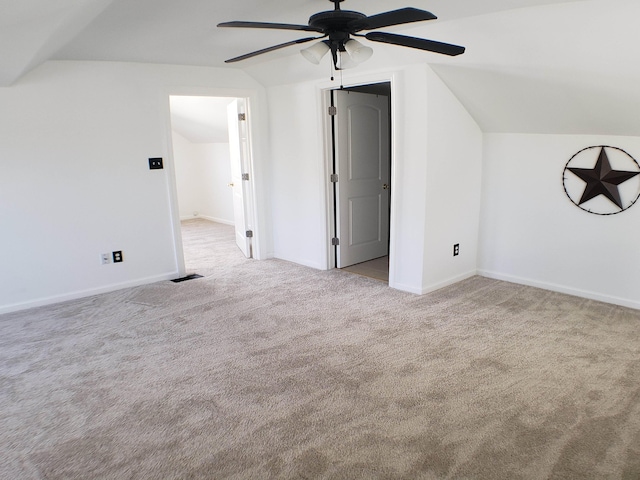 bonus room with ceiling fan, light colored carpet, and vaulted ceiling