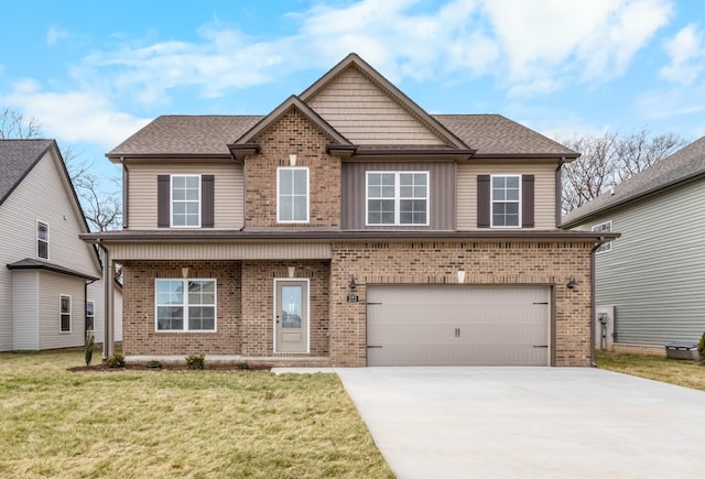 view of front of house featuring a garage and a front yard