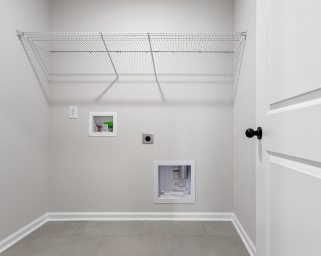 laundry room with hookup for an electric dryer, hookup for a washing machine, and tile patterned floors