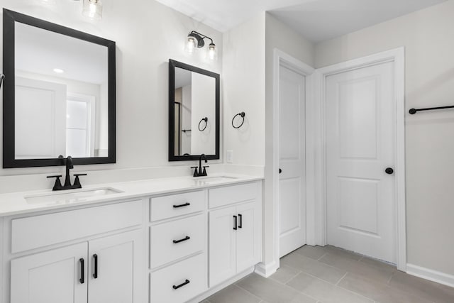 bathroom featuring vanity and tile patterned flooring