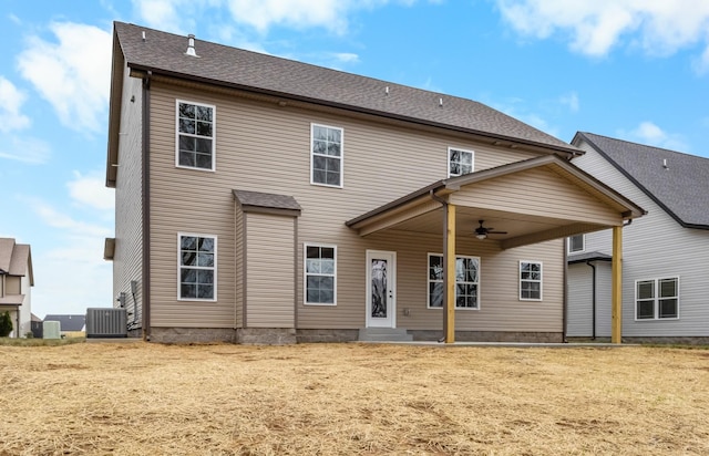 rear view of property featuring central AC and ceiling fan