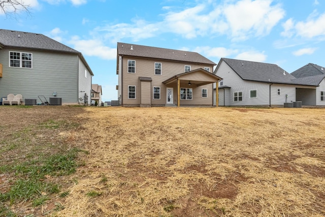 back of property featuring central AC