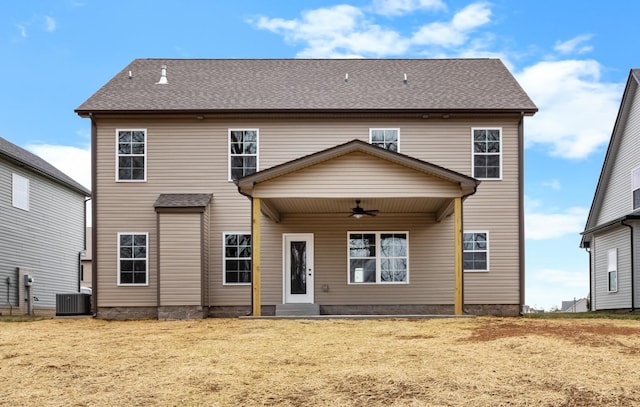 rear view of property featuring central AC and ceiling fan