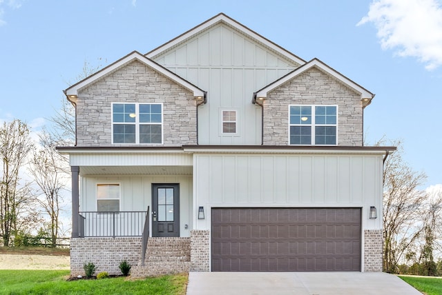 view of front of property with a garage and covered porch